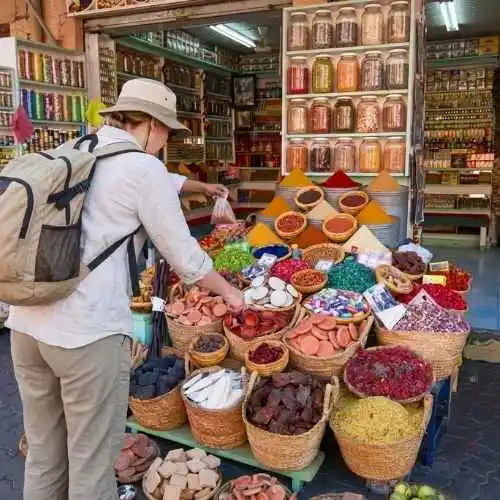 Marrakech Souks - Colorful spice pyramids at Souk El Attarine in Marrakech: turmeric, red pepper, cumin, and saffron displayed in a feast for the senses