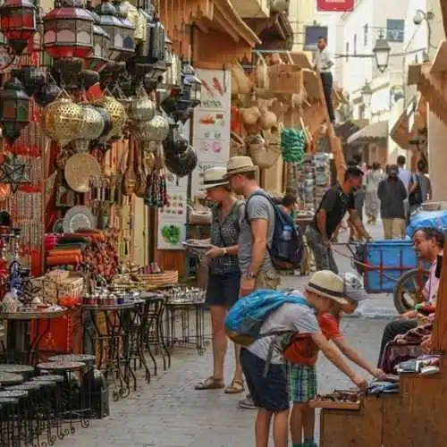 Traveling to Morocco with Kids_  Driven by curiosity, two children scour the shops of the Old City in search of hidden gems.