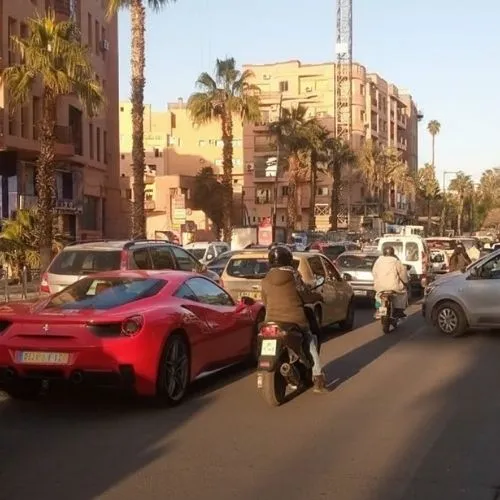 Driving rules in Morocco — heavy traffic and motorcycles in Marrakech city center