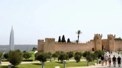 World's Tallest Buildings - Mohammed VI Tower rising behind the ancient walls of Chellah in Rabat, blending Morocco’s modern skyline with its historic heritage