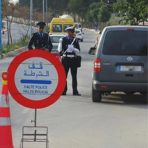 Morocco police checkpoint Halte Police sign with officers on duty