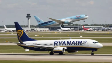 A Ryanair aircraft on the runway and a TUI plane at the airport