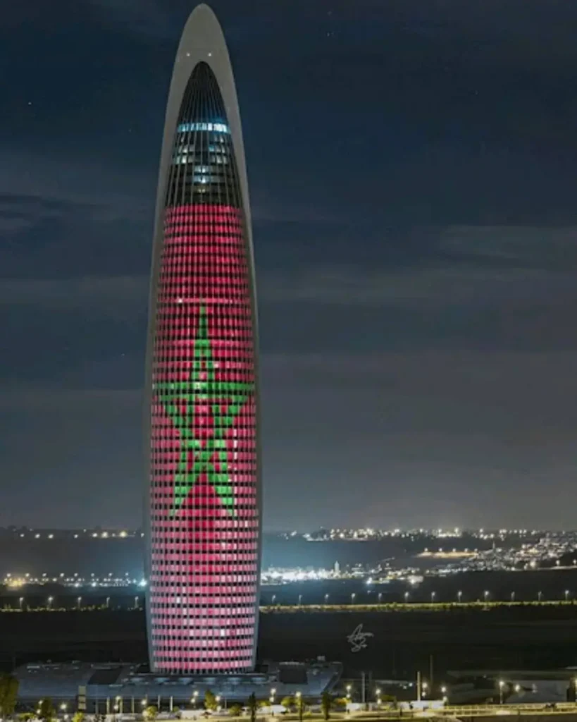 The Mohammed VI Tower in Rabat, Morocco's tallest building and third tallest in Africa among the world's tallest buildings, illuminated with the Moroccan flag at night