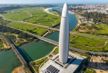 Aerial view of the Mohammed VI Tower in Rabat overlooking the Bouregreg Valley and modern infrastructure — a symbol of the ambition behind tourism investment in Morocco.