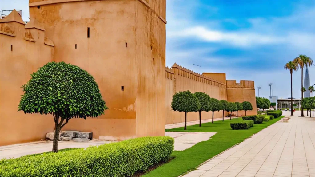 Historic fortified walls of Sale with the Mohammed VI Tower in the background, showcasing the blend of heritage and modernity that fuels tourism investment in Morocco.