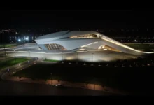 Night view of The Royal Theatre of Rabat illuminated along the Bouregreg riverfront in Rabat, Morocco.