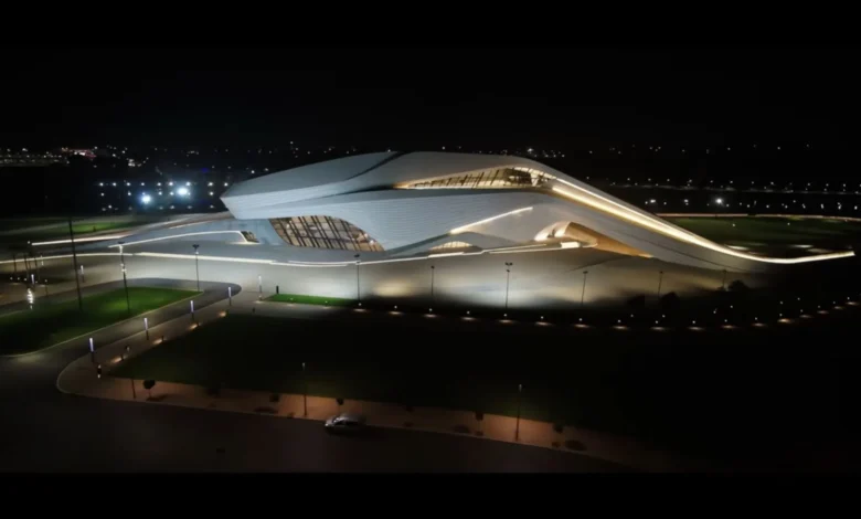 Night view of The Royal Theatre of Rabat illuminated along the Bouregreg riverfront in Rabat, Morocco.
